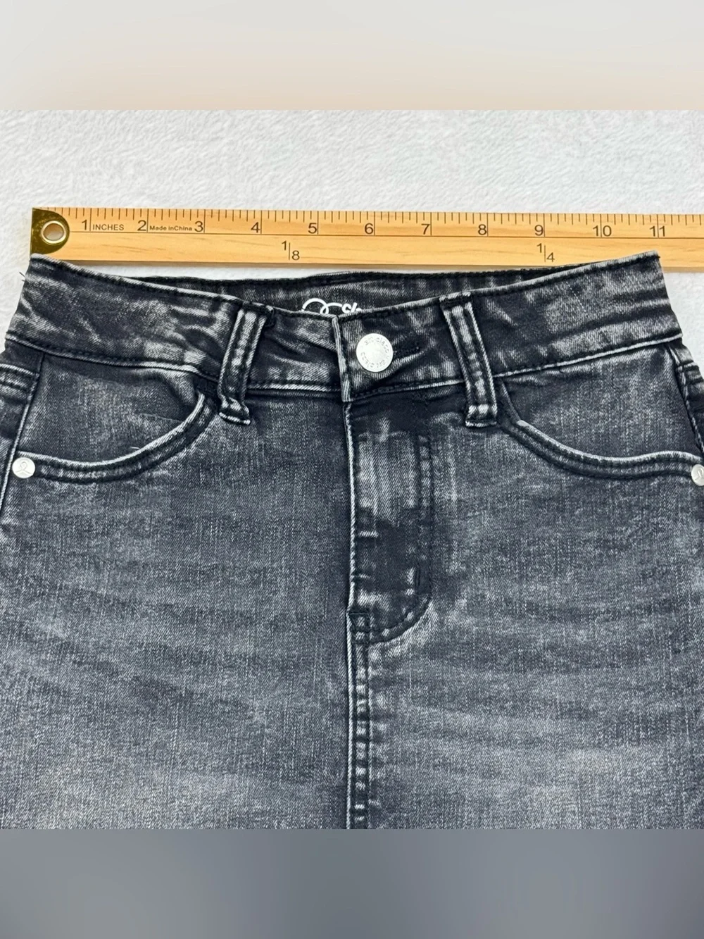 Lot of 2 girls denim skirts. The blue shirt is a size 8, black skirt is size 7/8